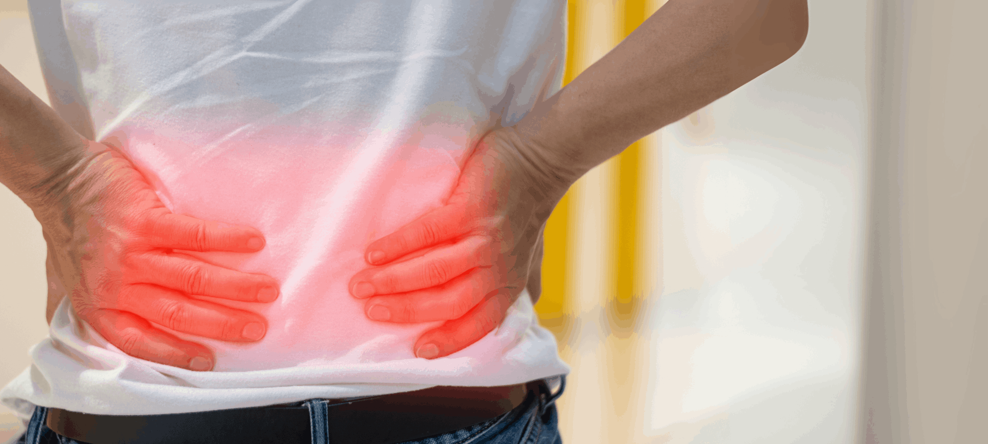 Man holding his back in pain Man holding his back in pain