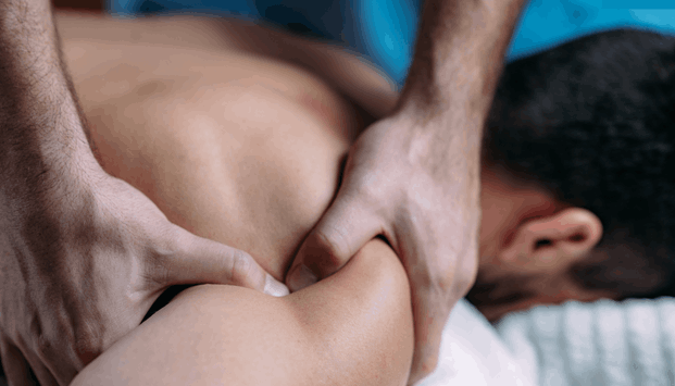 Massage Therapy to Improve Sleep Quality & Insomnia (1) A man getting Massage Therapy to Improve Sleep Quality & Insomnia